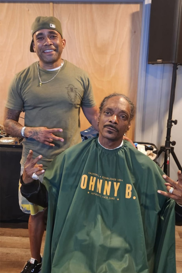 Joey Brixx working with a client in the chair